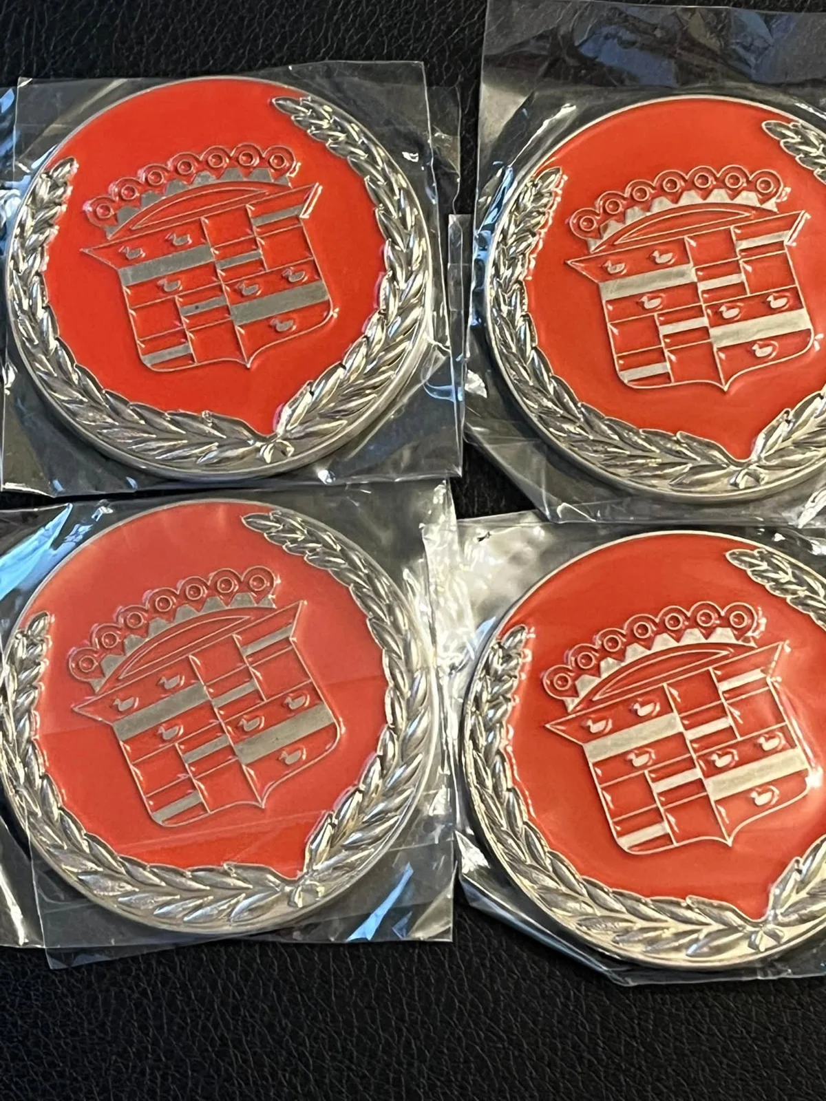 Red Cadillac crest lowrider wire-wheel chips
